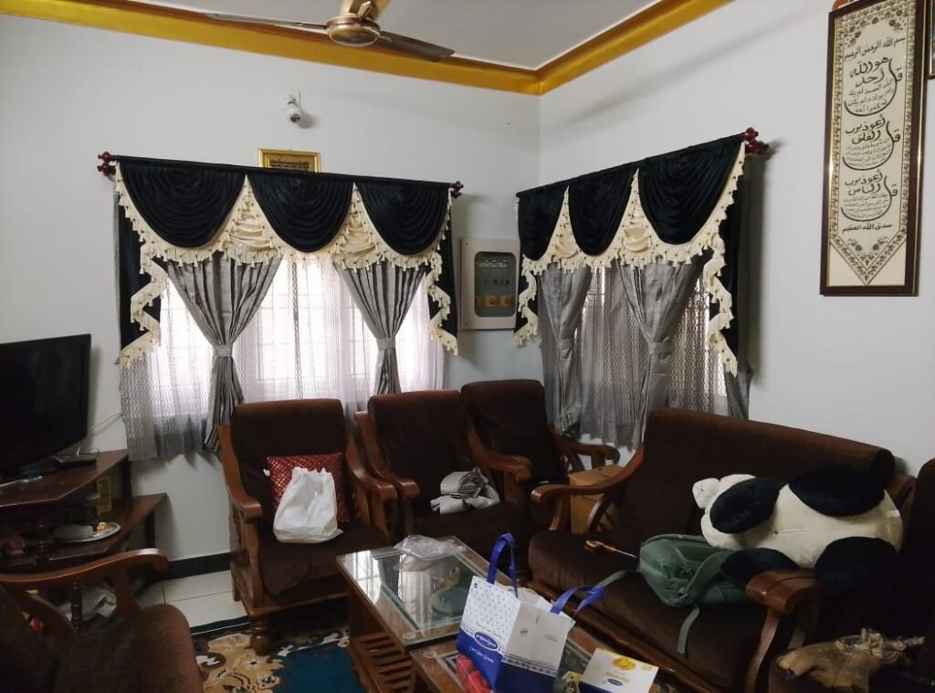 Decorative curtains with valance in a Pollachi living room