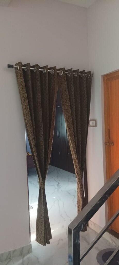 Eyelet door curtain with tieback