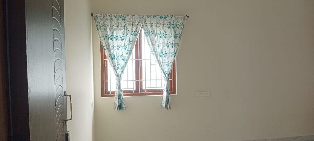 Floral sheer curtains on a bedroom window