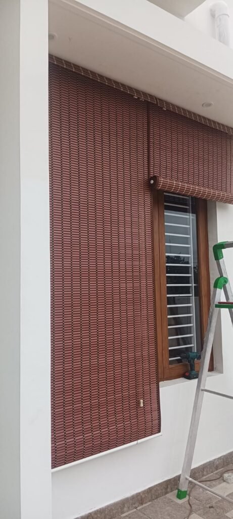 Outdoor PVC roll-up blind on a veranda
