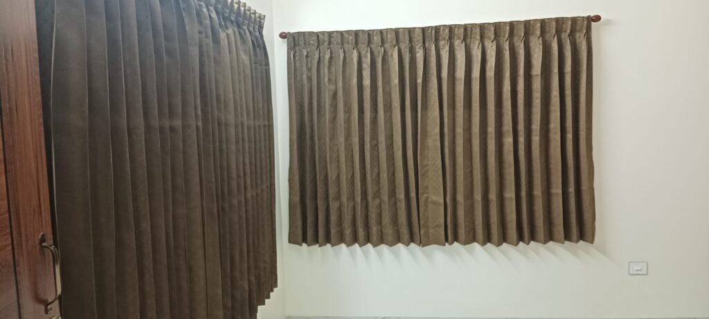 Pleated curtains fitted in a bedroom